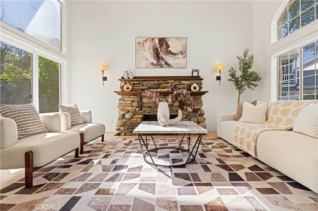 a view of living room with furniture and a window