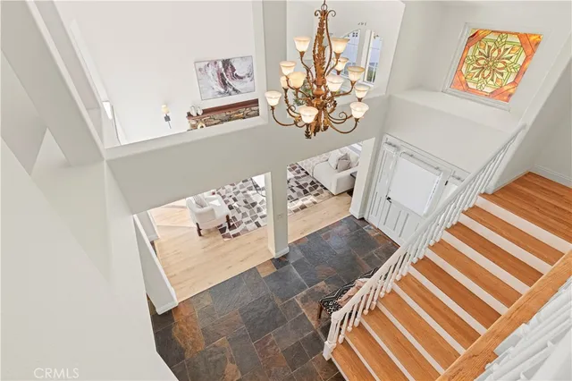 a bathroom with a sink a toilet a mirror and shower