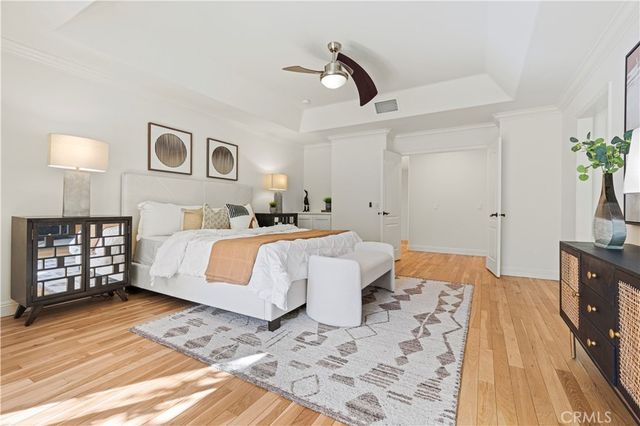 a view of a patio with table and chairs potted plants with large tree