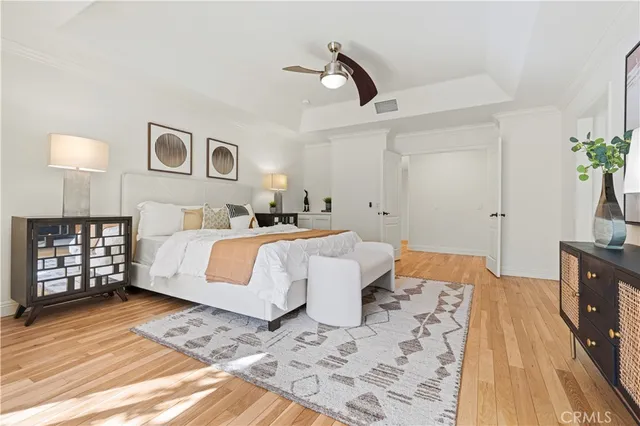 a view of a patio with table and chairs potted plants with large tree