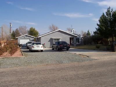 12791 Pocomoke Road Apple Valley, CA 92308 - Photo 1 of 1 a car parked in front of house
