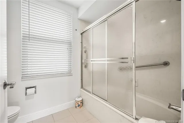 a bathroom with a shower and a toilet