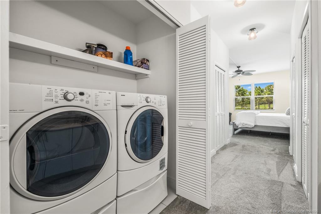 13226 Harbour Ridge Boulevard, Unit 5B Palm City, FL 34990 - Photo 20 of 28 a utility room with dryer and washer
