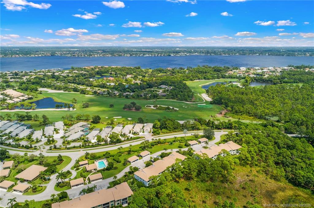 13226 Harbour Ridge Boulevard, Unit 5B Palm City, FL 34990 - Photo 25 of 28 a view of a city with lots of green space