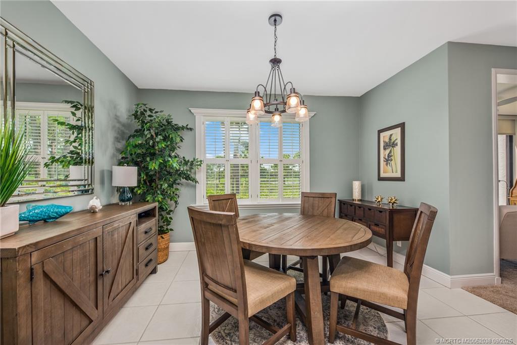 13226 Harbour Ridge Boulevard, Unit 5B Palm City, FL 34990 - Photo 10 of 28 a dining room with furniture and window