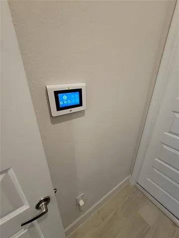 a view of a room with rack on the wall and a window