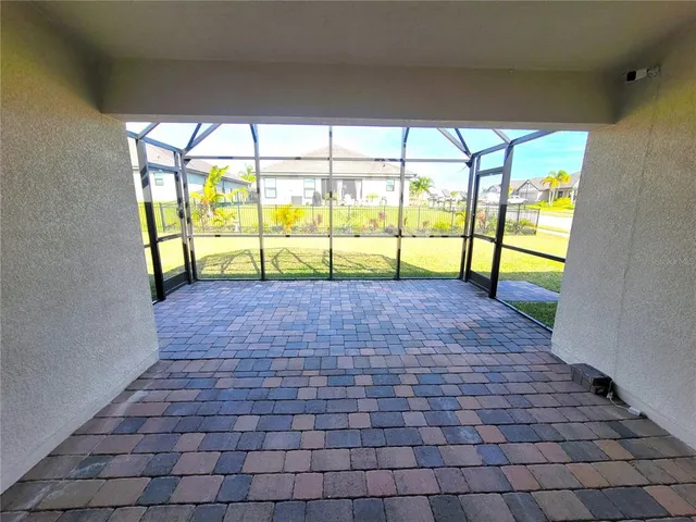 a view of empty room with windows