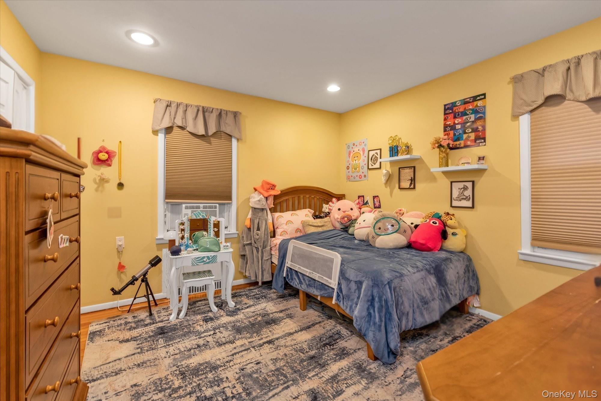 29 Orleans Road Valley Stream, NY 11581 - Photo 13 of 20 a bed room with a bed and a chair