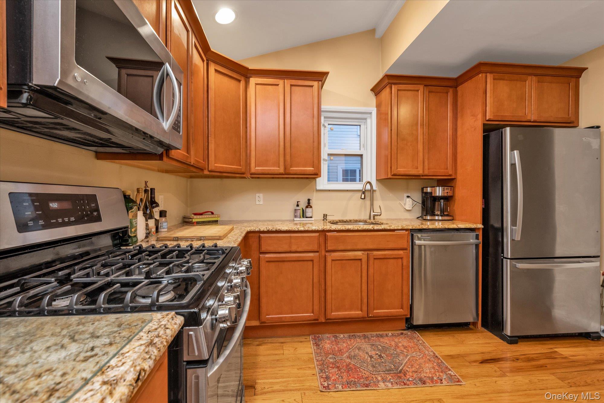 29 Orleans Road Valley Stream, NY 11581 - Photo 8 of 20 a kitchen with stainless steel appliances granite countertop a stove a sink dishwasher and a refrigerator