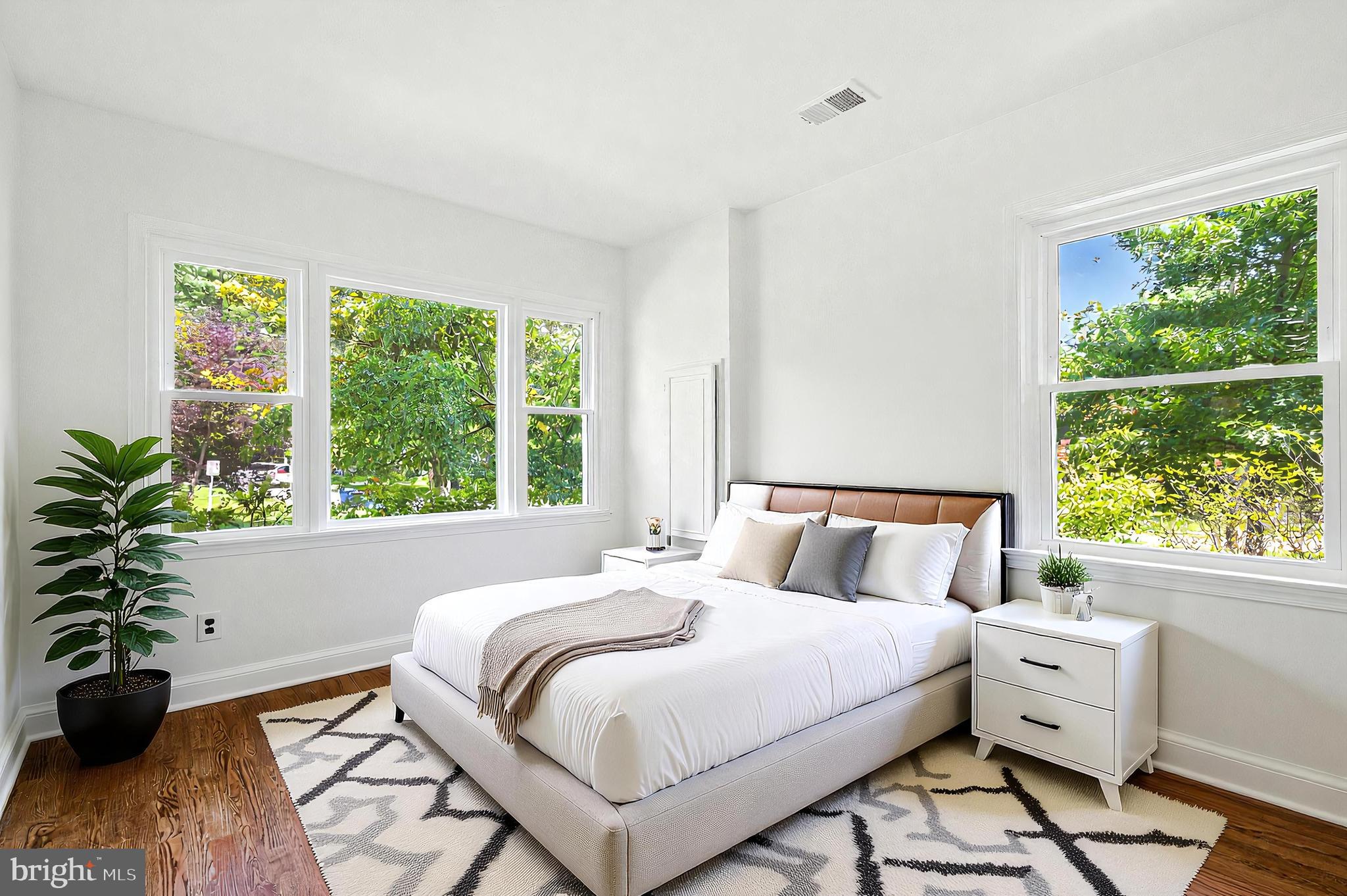 307 Plymouth Street Silver Spring, MD 20901 - Photo 13 of 44 a bedroom with a bed and a large window