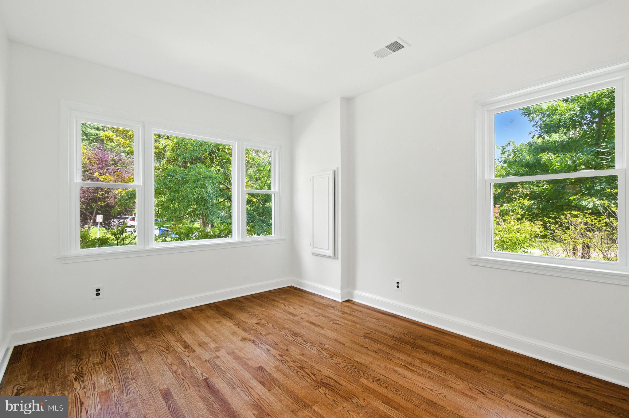 307 Plymouth Street Silver Spring, MD 20901 - Photo 14 of 44 a view of empty room with wooden floor and fan