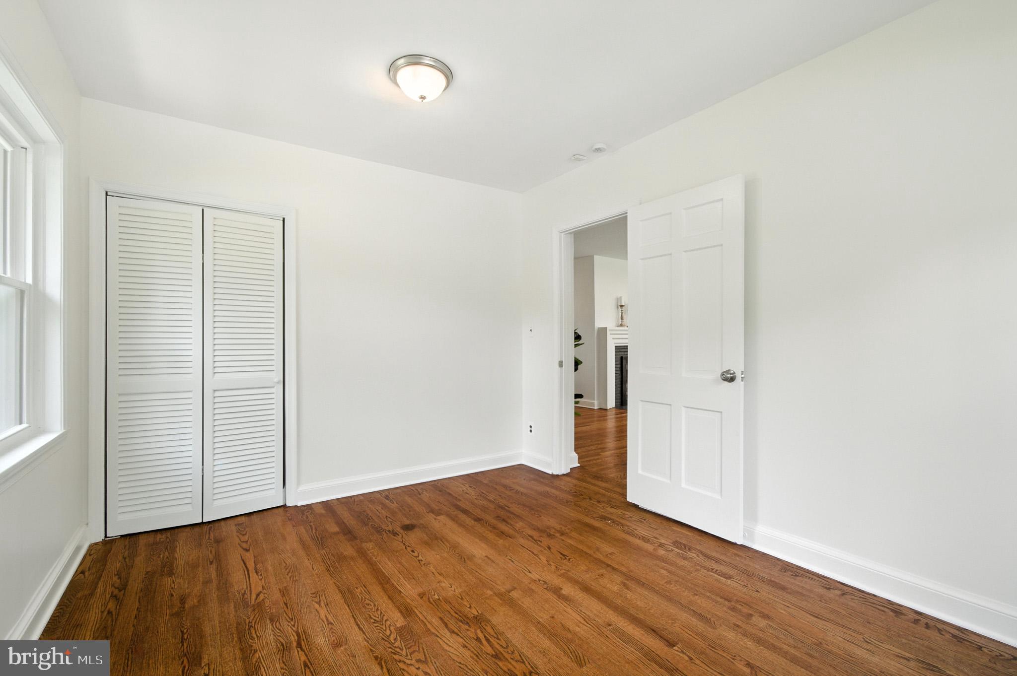 307 Plymouth Street Silver Spring, MD 20901 - Photo 15 of 44 a view of empty room with wooden floor