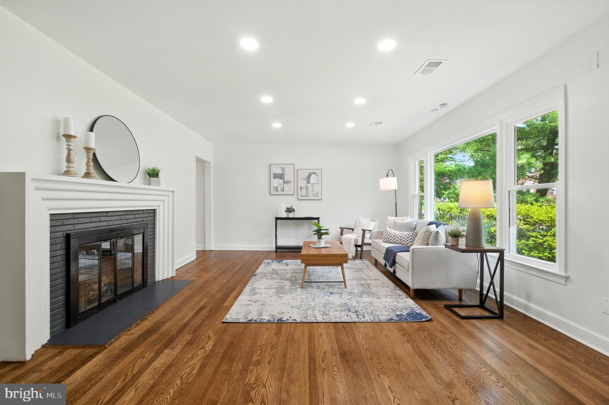 307 Plymouth Street Silver Spring, MD 20901 - Photo 16 of 44 a living room with furniture and a fireplace
