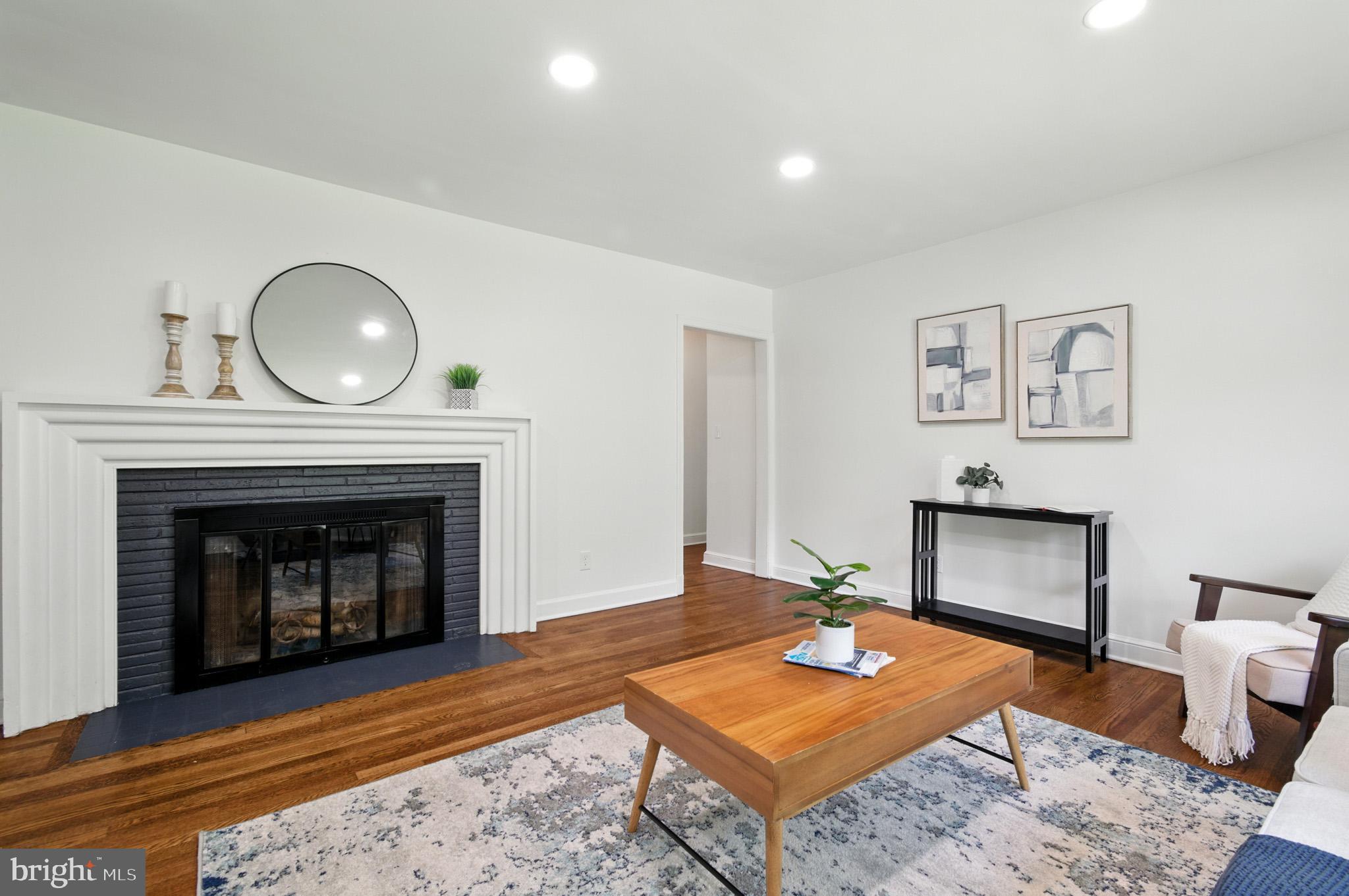 307 Plymouth Street Silver Spring, MD 20901 - Photo 18 of 44 a living room with furniture and a fireplace