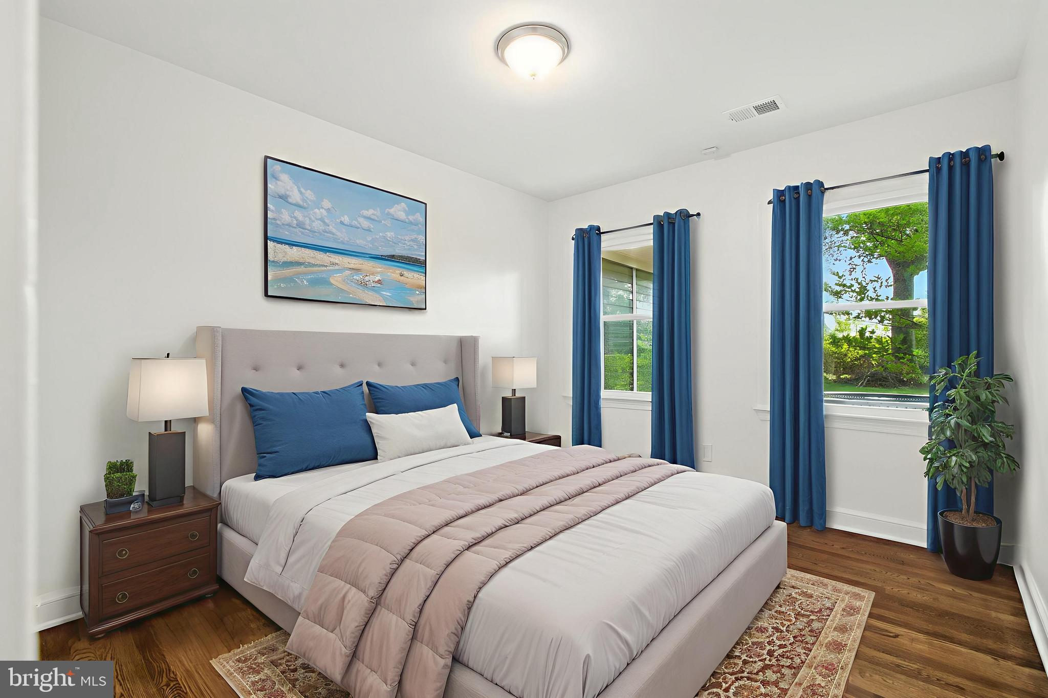 307 Plymouth Street Silver Spring, MD 20901 - Photo 20 of 44 a bedroom with bed and a large window