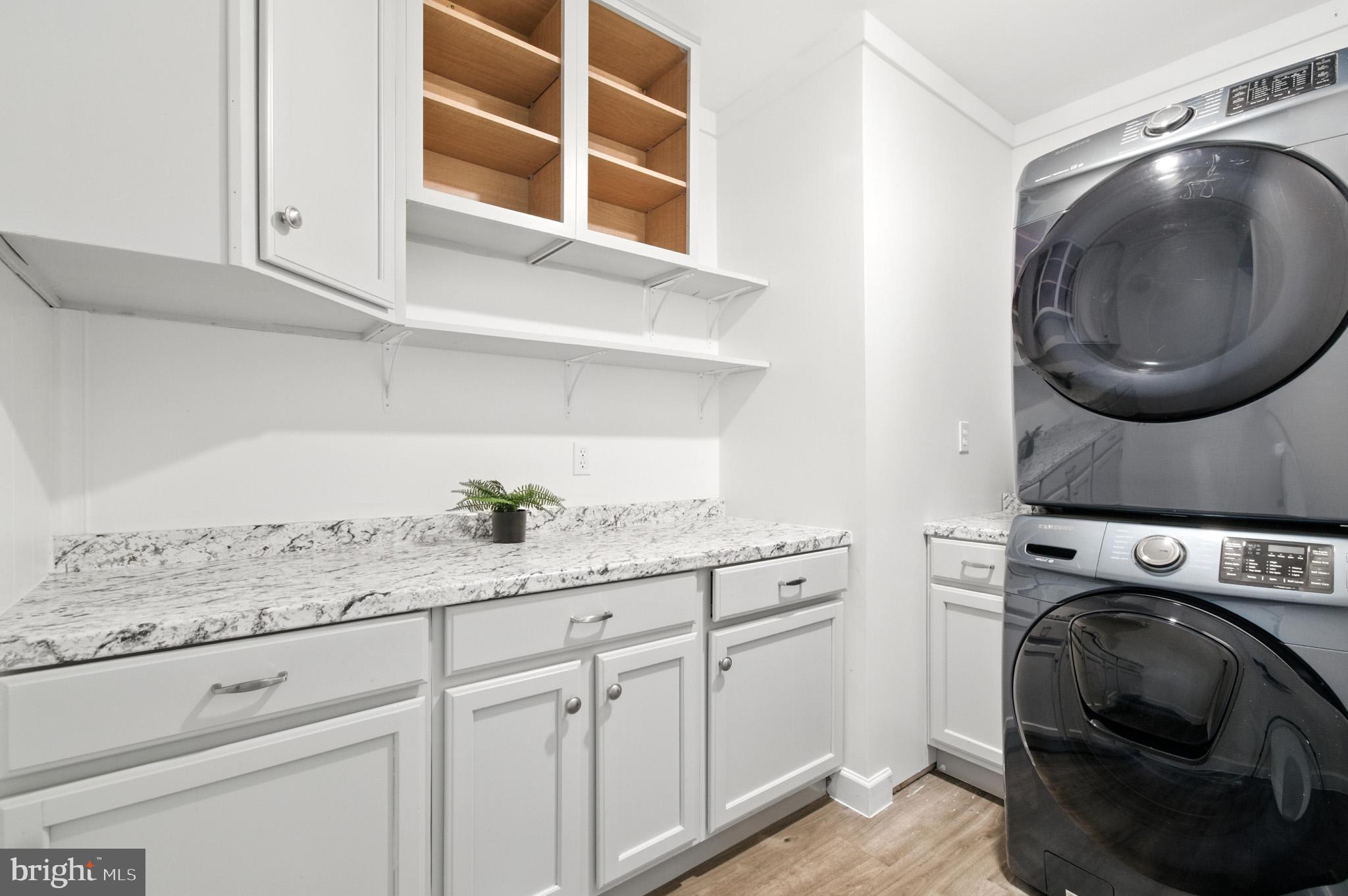 307 Plymouth Street Silver Spring, MD 20901 - Photo 30 of 44 a utility room with sink dryer and washer