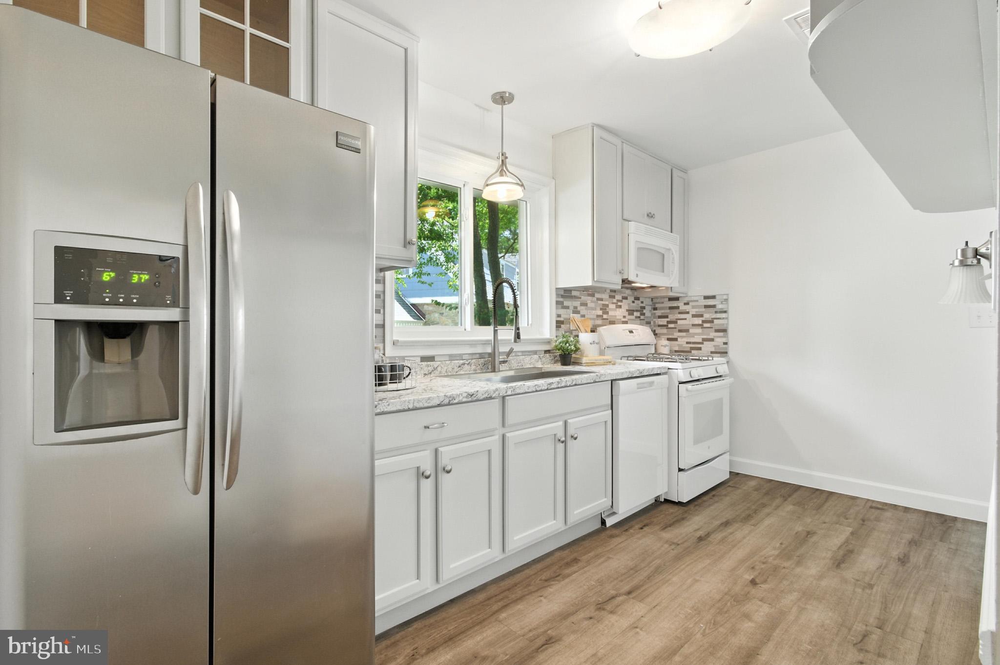 307 Plymouth Street Silver Spring, MD 20901 - Photo 32 of 44 a bathroom with a double vanity sink and mirror