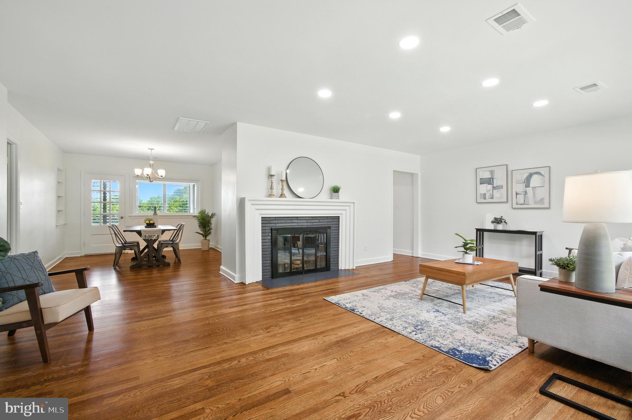 307 Plymouth Street Silver Spring, MD 20901 - Photo 4 of 44 a living room with furniture and a fireplace
