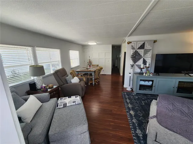 a bathroom with a sink a mirror a vanity and shower