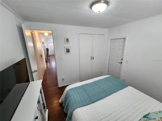 a bed room with a bed and a window