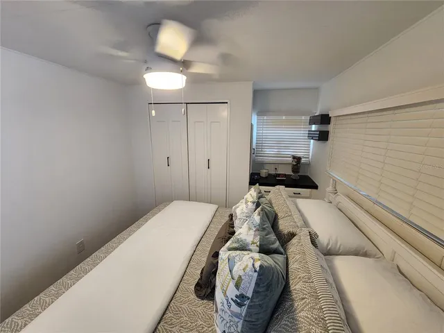 a bedroom with a bed and a couch