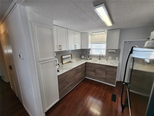 a room with refrigerator and window