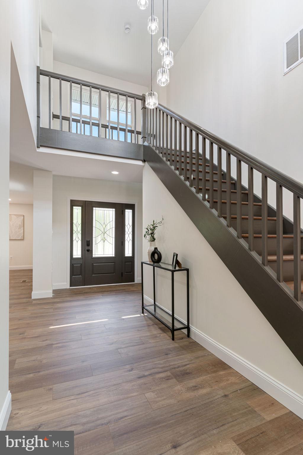 4735 Paul Hance Road Huntingtown, MD 20639 - Photo 7 of 64 a view of staircase with a black and white walls