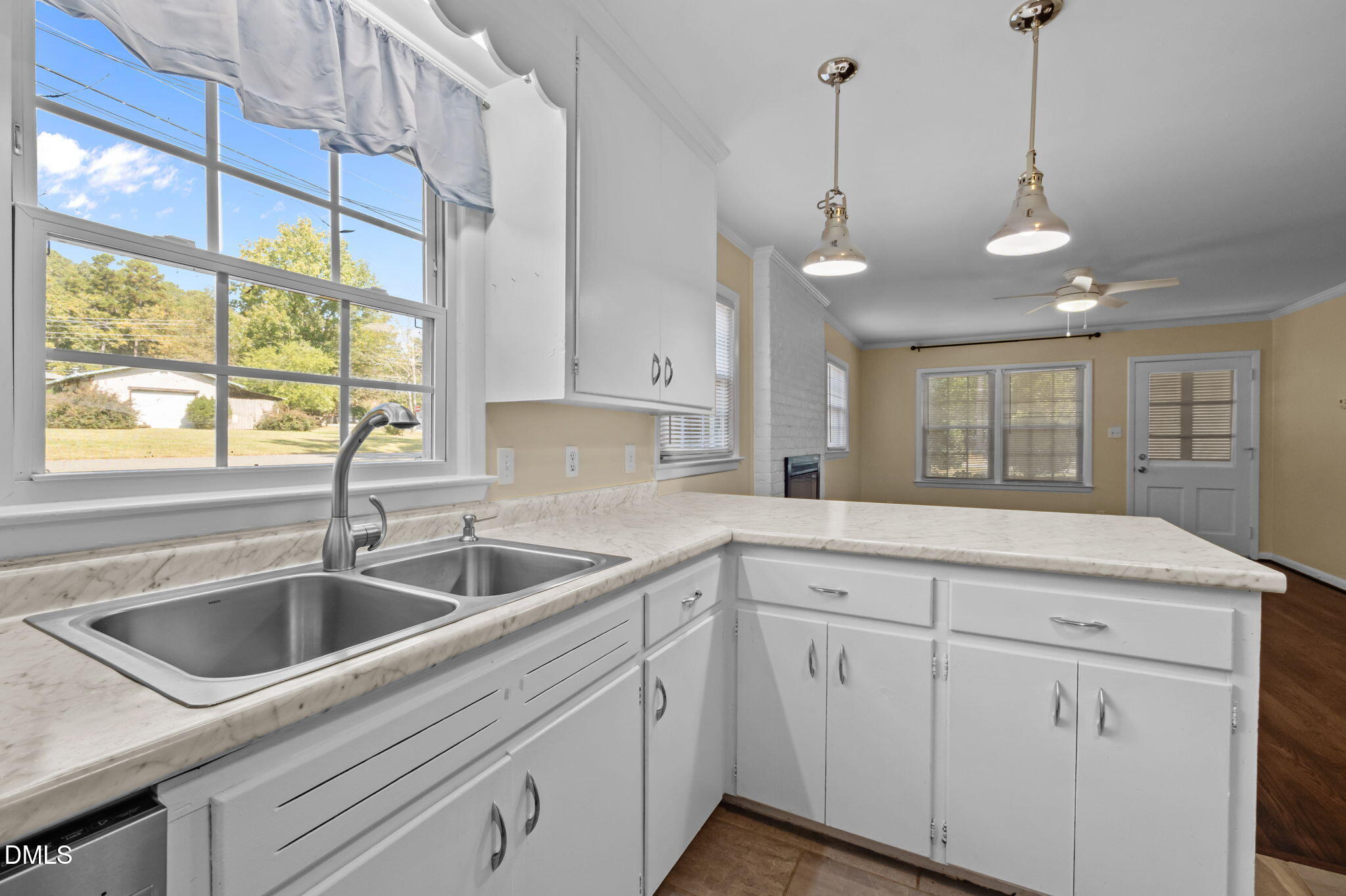 200 Davie Road, Unit A&B Carrboro, NC 27510 - Photo 10 of 36 a kitchen with white cabinets and a sink
