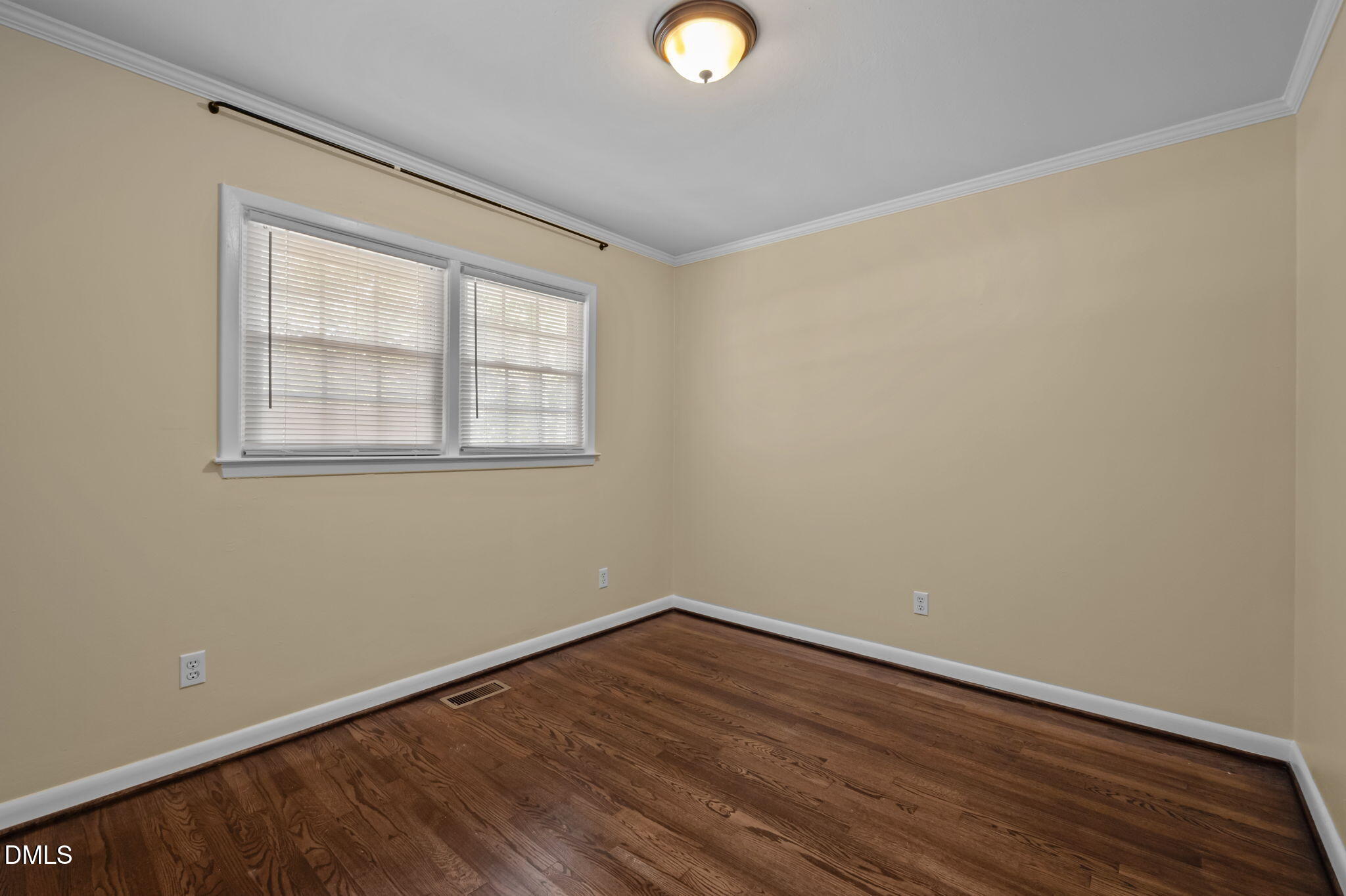 200 Davie Road, Unit A&B Carrboro, NC 27510 - Photo 13 of 36 a view of an empty room with wooden floor and a window