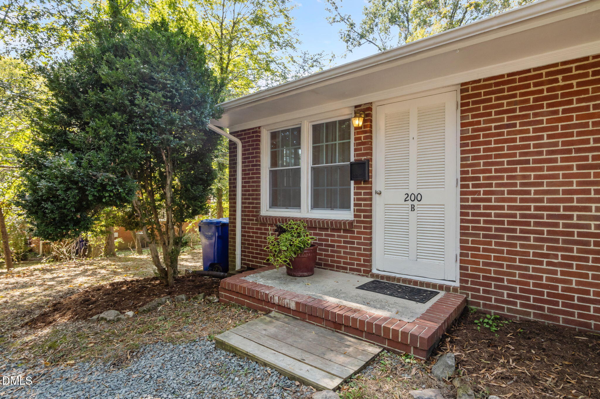 200 Davie Road, Unit A&B Carrboro, NC 27510 - Photo 16 of 36 a front view of a house with garden