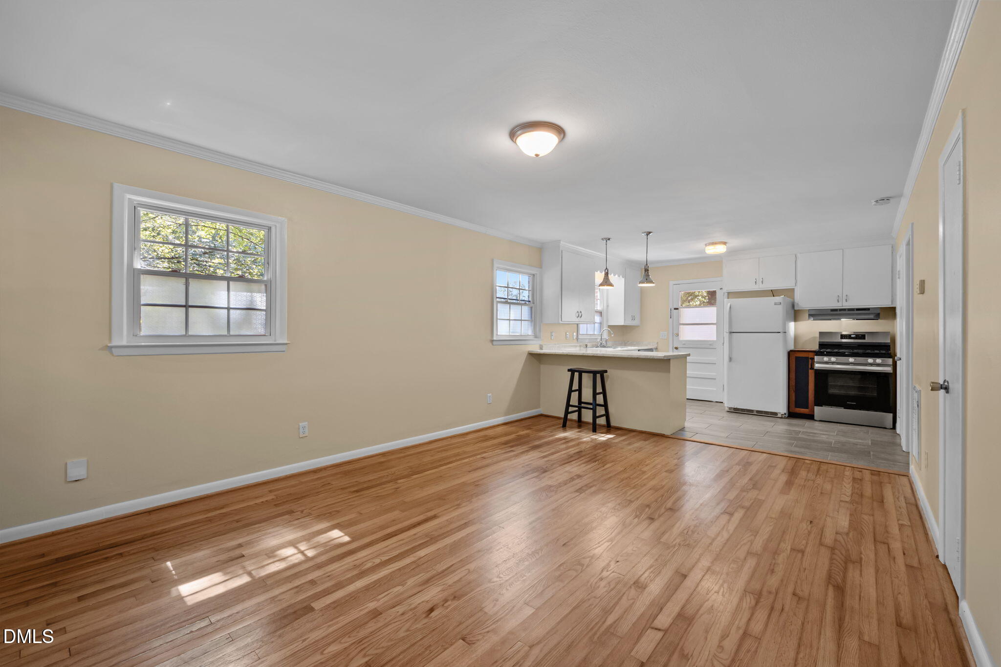 200 Davie Road, Unit A&B Carrboro, NC 27510 - Photo 18 of 36 a view of a kitchen with wooden floor electronic appliances and window