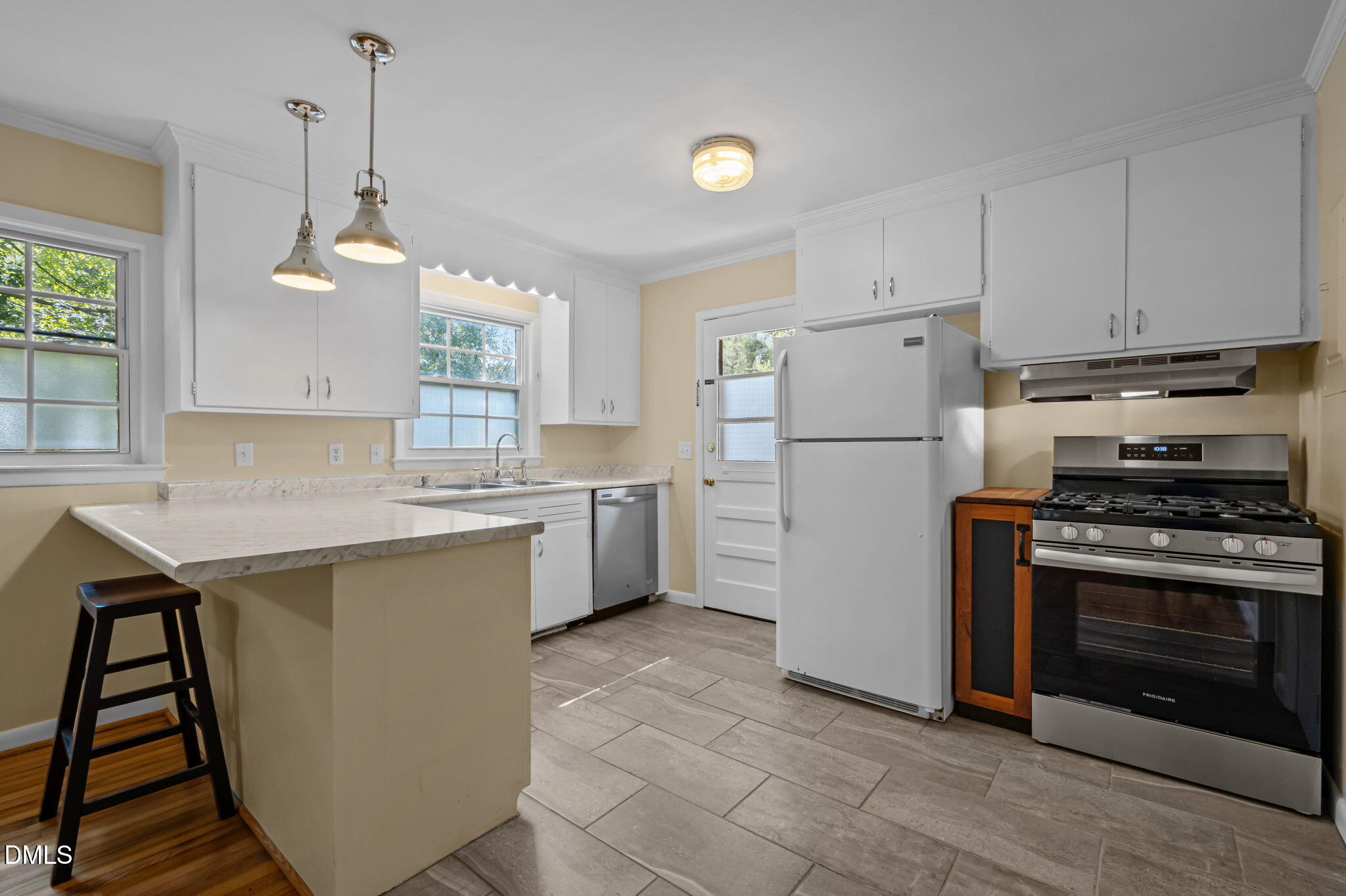 200 Davie Road, Unit A&B Carrboro, NC 27510 - Photo 21 of 36 a kitchen with a stove a refrigerator and a sink