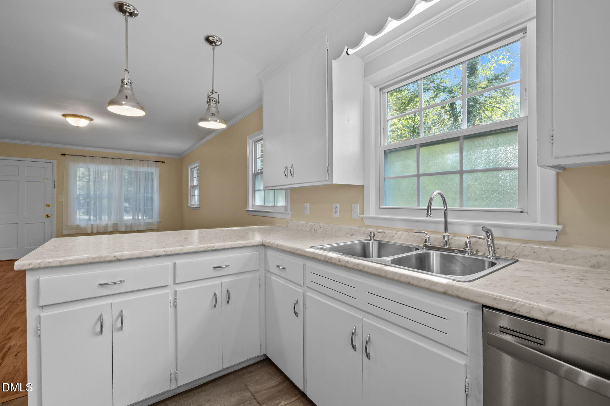200 Davie Road, Unit A&B Carrboro, NC 27510 - Photo 23 of 36 a kitchen with sink cabinets and window