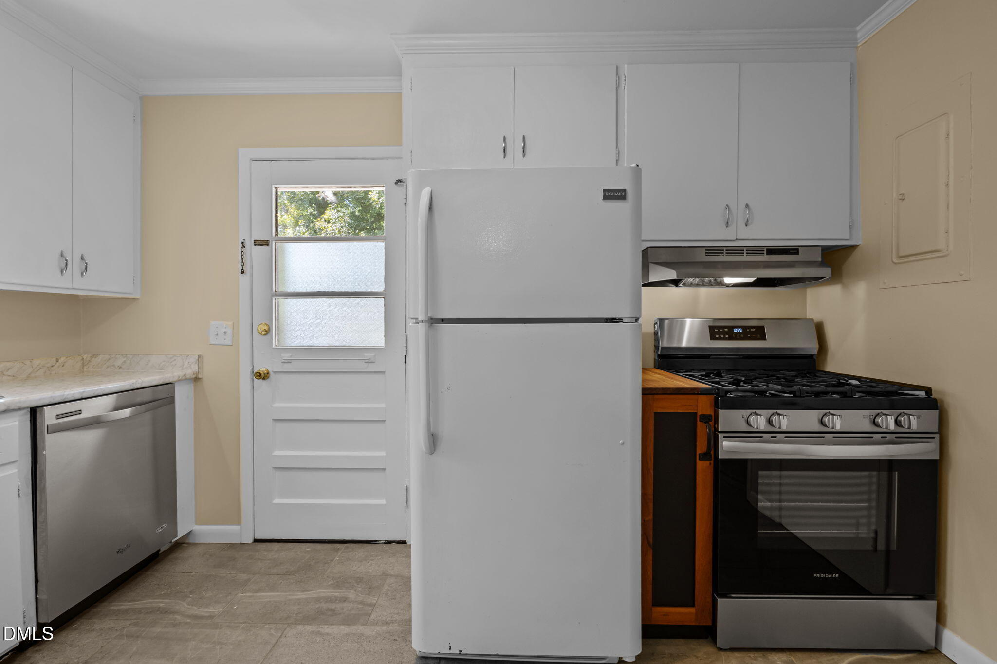 200 Davie Road, Unit A&B Carrboro, NC 27510 - Photo 24 of 36 a kitchen with a stove and white cabinets