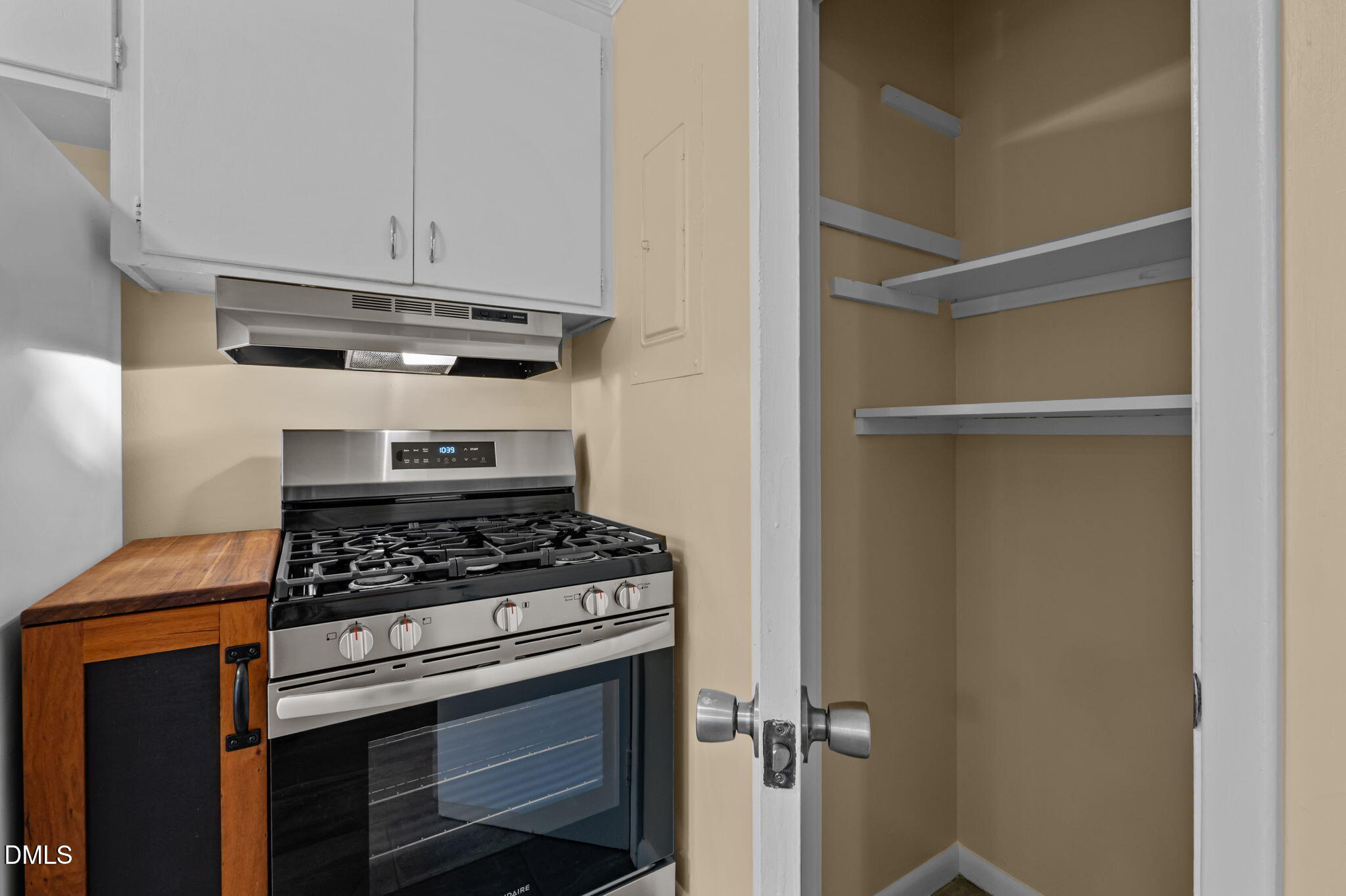 200 Davie Road, Unit A&B Carrboro, NC 27510 - Photo 25 of 36 a kitchen with a stove and white cabinets