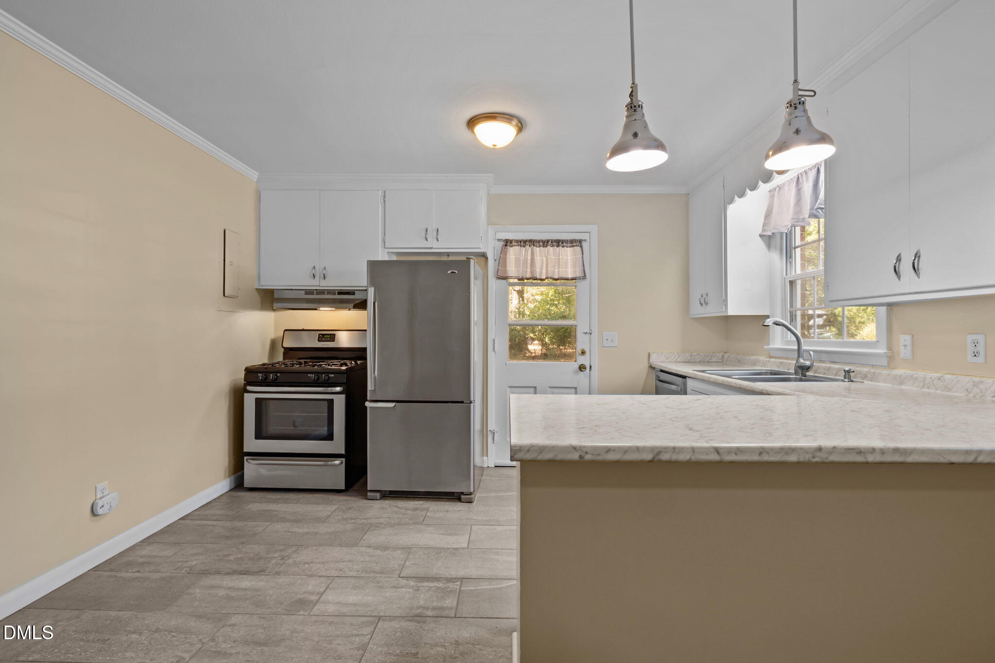 200 Davie Road, Unit A&B Carrboro, NC 27510 - Photo 7 of 36 a kitchen with kitchen island a counter space a sink and appliances