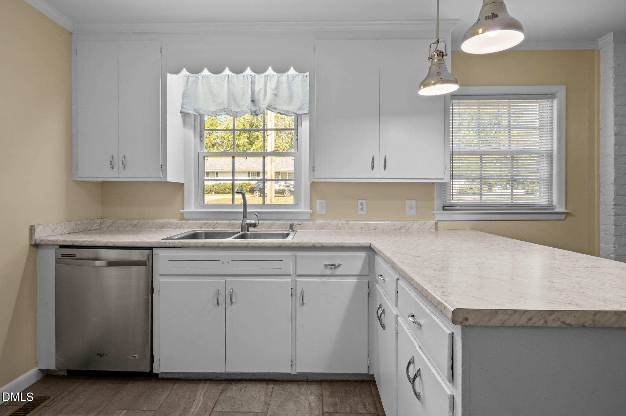 200 Davie Road, Unit A&B Carrboro, NC 27510 - Photo 9 of 36 a kitchen with granite countertop white cabinets and a sink