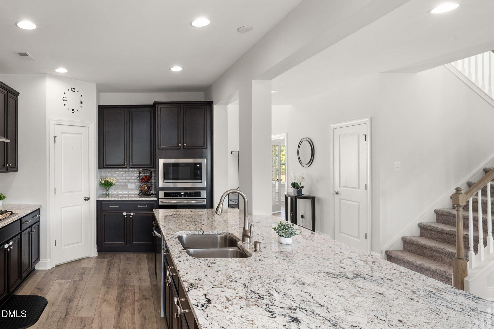 3422 Longleaf Estates Drive Raleigh, NC 27616 - Photo 23 of 71 a kitchen with granite countertop a stove a sink and a refrigerator