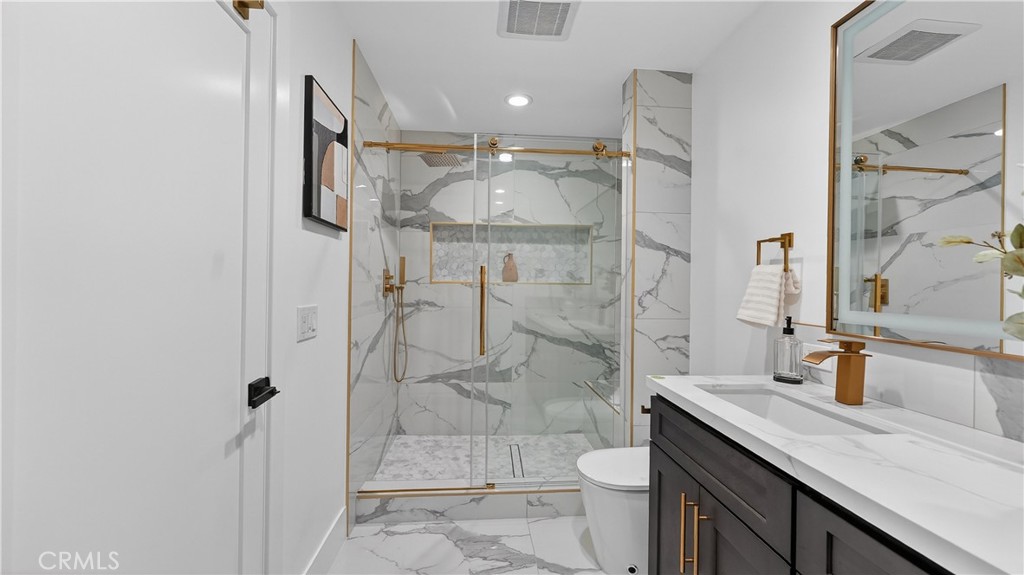 4404 Cogswell Road El Monte, CA 91732 - Photo 16 of 63 a bathroom with a sink a toilet and shower