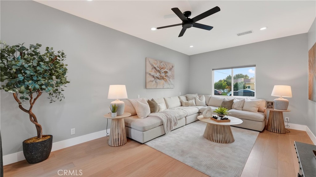 4404 Cogswell Road El Monte, CA 91732 - Photo 28 of 63 a living room with furniture potted plant and a window