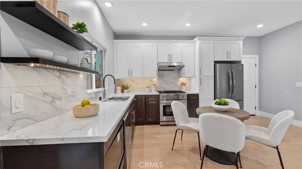 4404 Cogswell Road El Monte, CA 91732 - Photo 49 of 63 a kitchen with a sink stainless steel appliances and cabinets