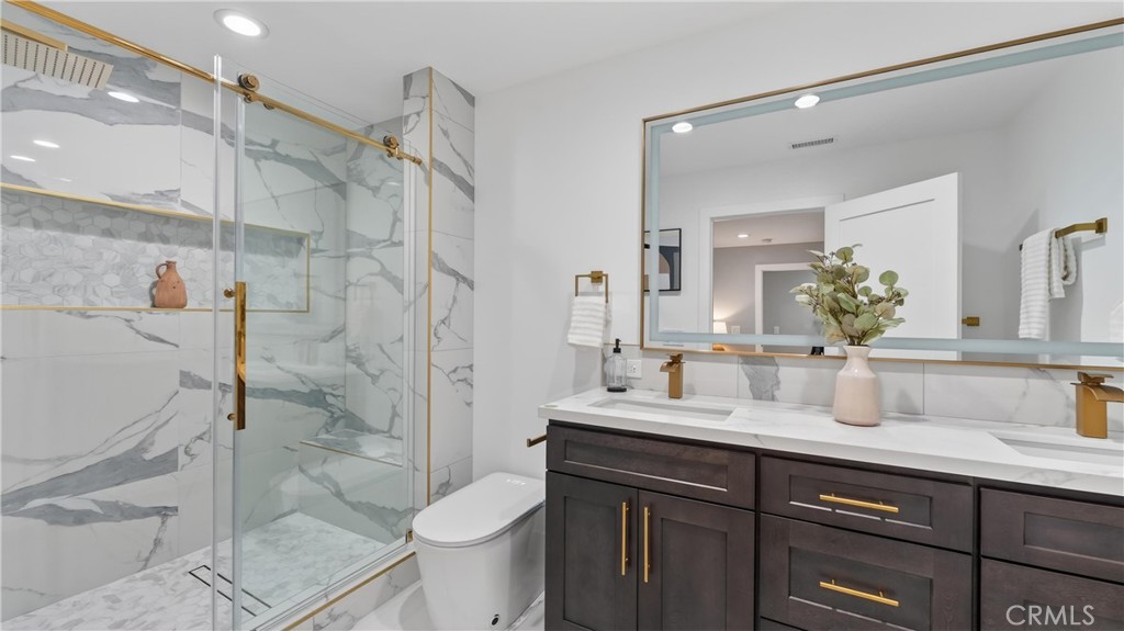 4404 Cogswell Road El Monte, CA 91732 - Photo 9 of 63 a bathroom with a sink toilet a mirror and shower