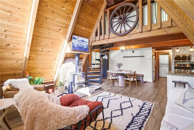 a bedroom with furniture and a large window