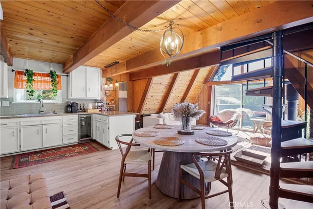 a kitchen with a table chairs and a stove