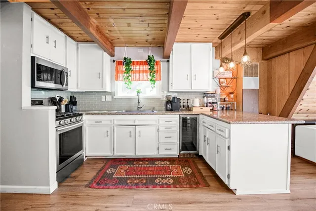 a kitchen with a sink stove and microwave