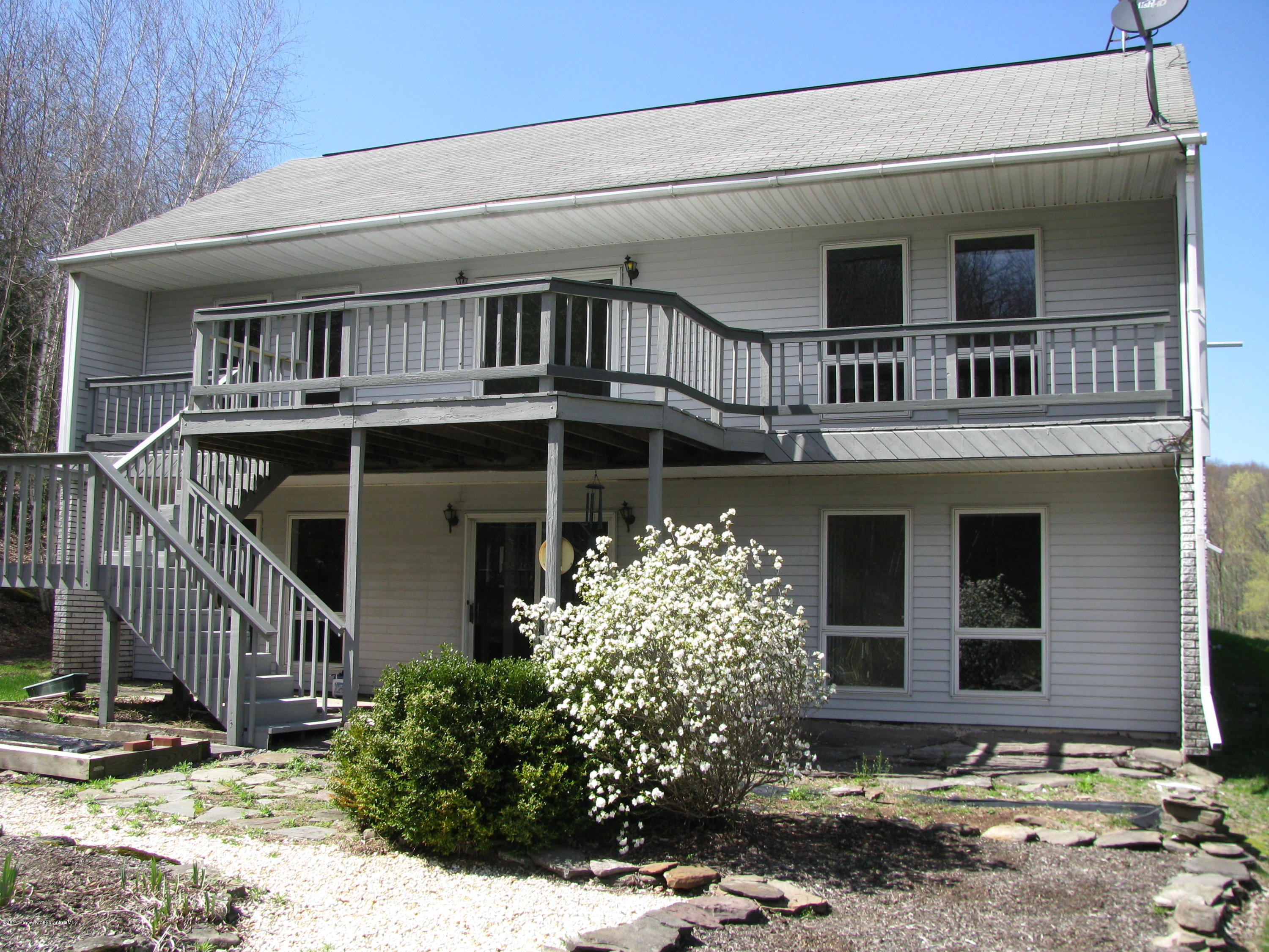 155 Blossom Road Nicholson, PA 18446 - Photo 1 of 35 a front view of a house