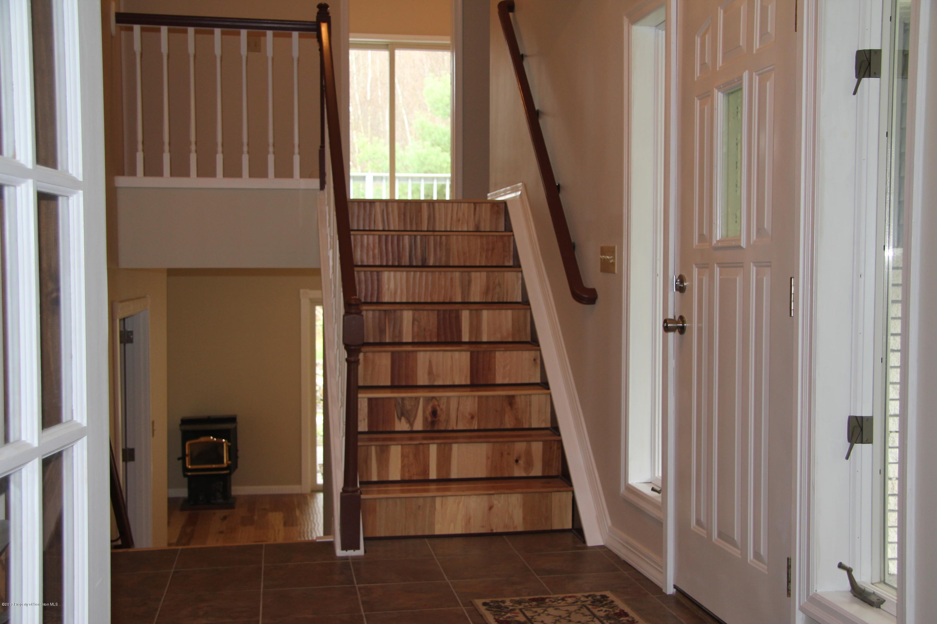 155 Blossom Road Nicholson, PA 18446 - Photo 11 of 35 a view of entryway with wooden floor and stairs