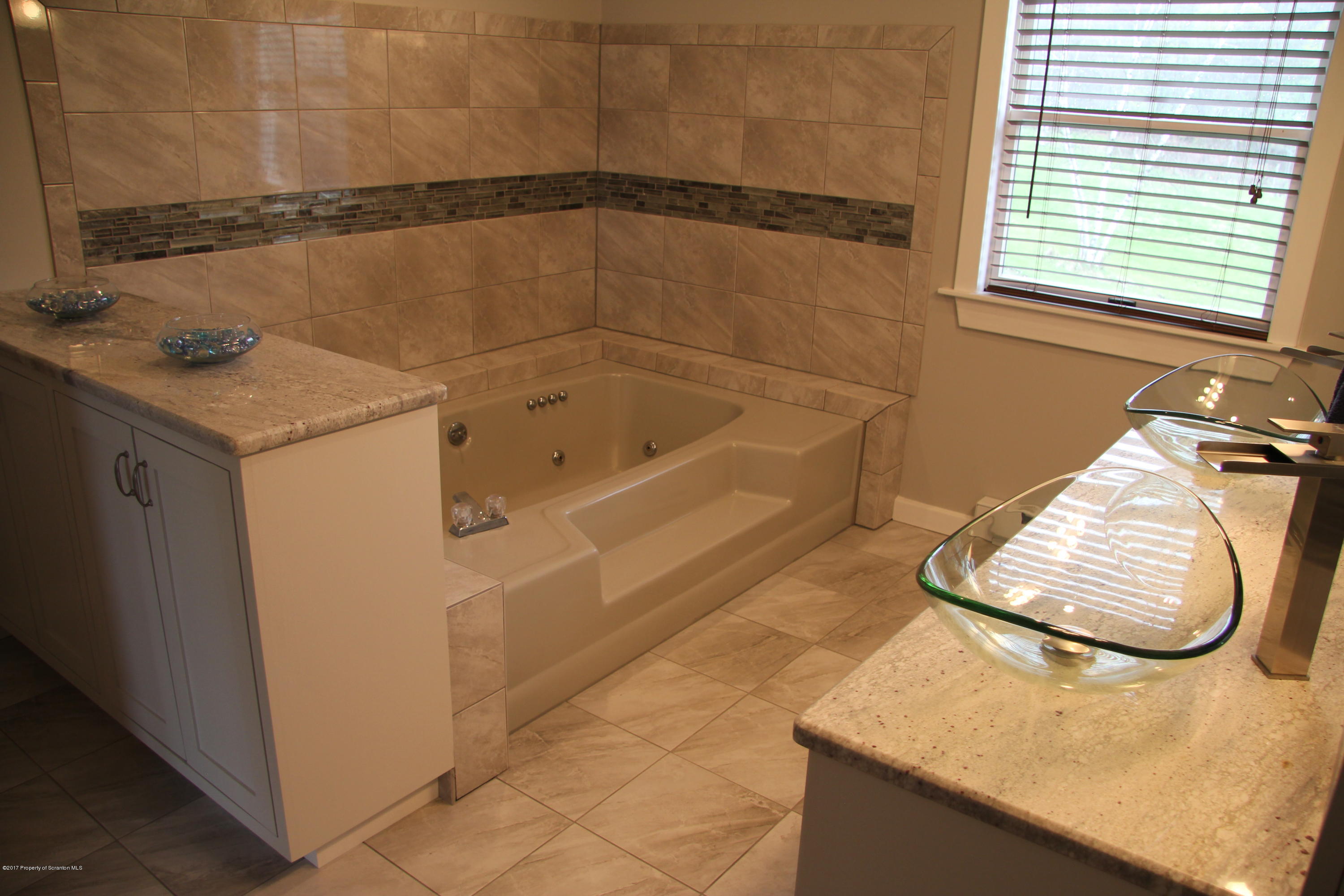 155 Blossom Road Nicholson, PA 18446 - Photo 15 of 35 a bathroom with a sink and a bathtub