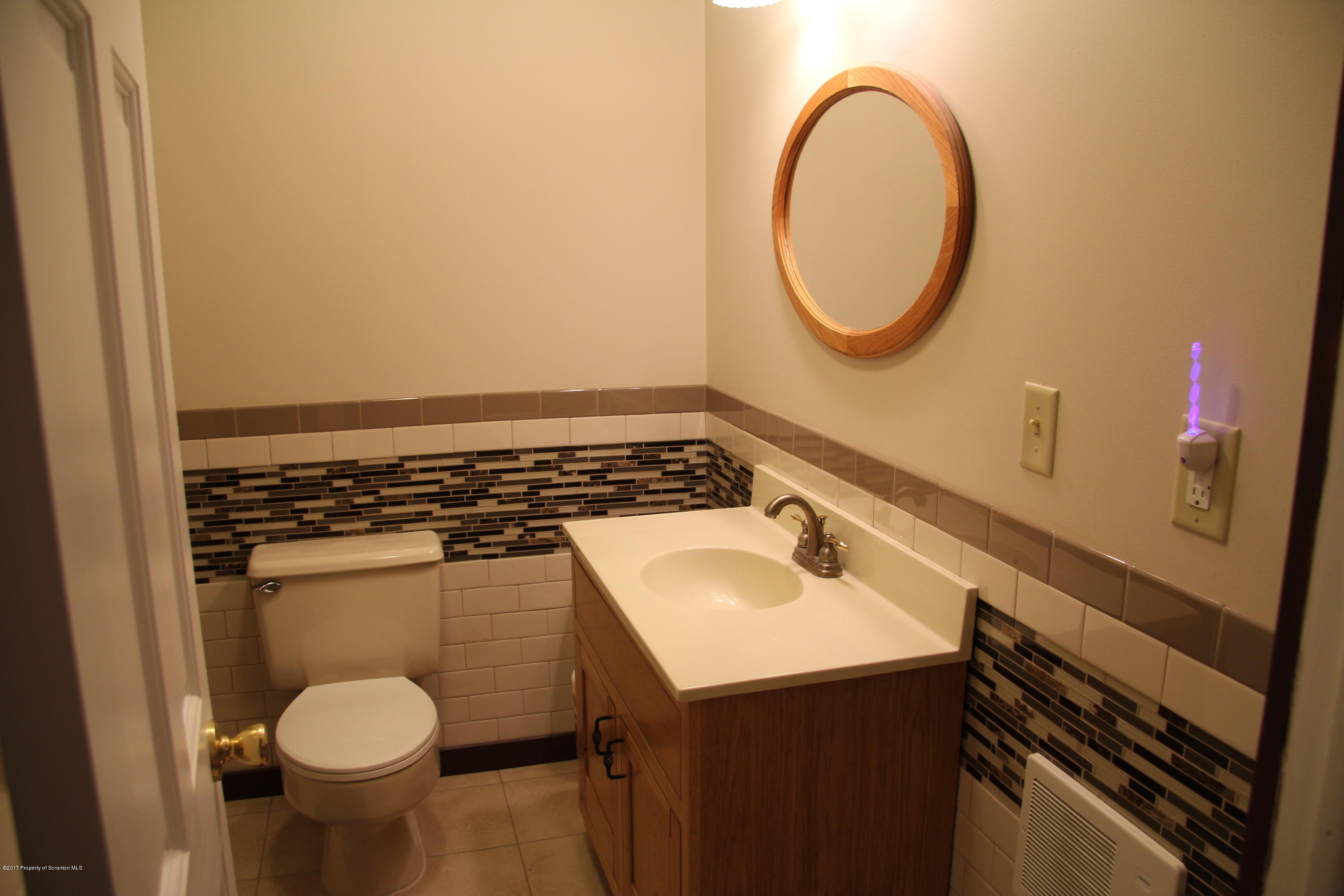 155 Blossom Road Nicholson, PA 18446 - Photo 18 of 35 a bathroom with a sink toilet and a mirror