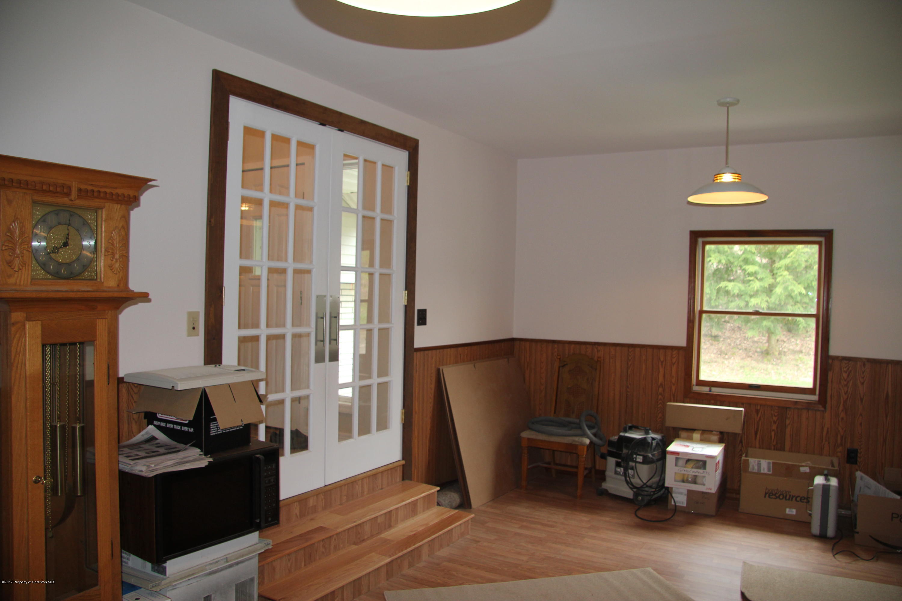 155 Blossom Road Nicholson, PA 18446 - Photo 19 of 35 a living room with furniture a fireplace and a window